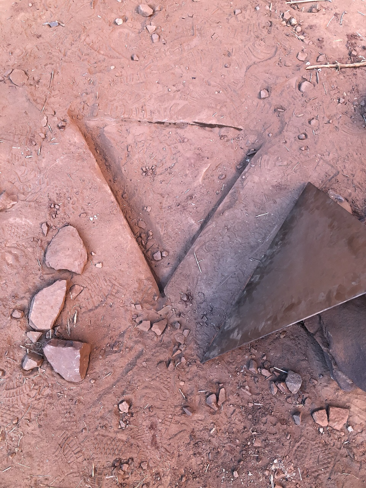 The empty spot in the red rock where the monolith had stood